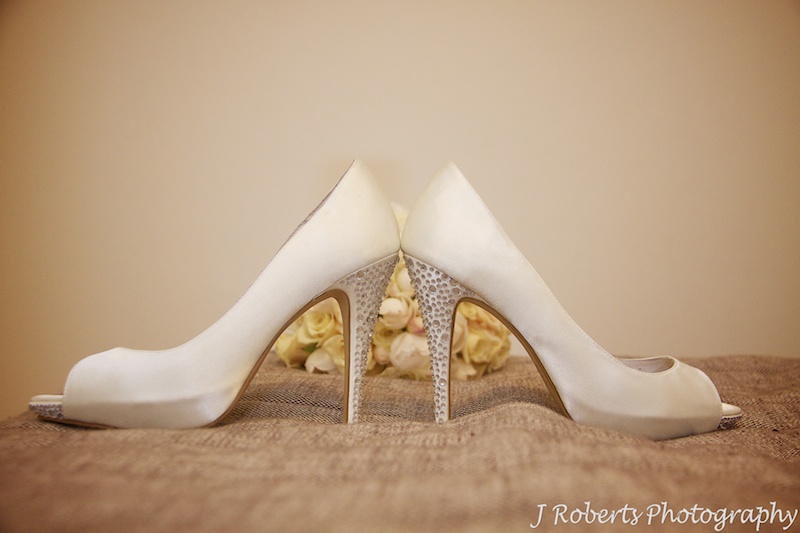 Bridal shoes on bed - wedding photography sydney